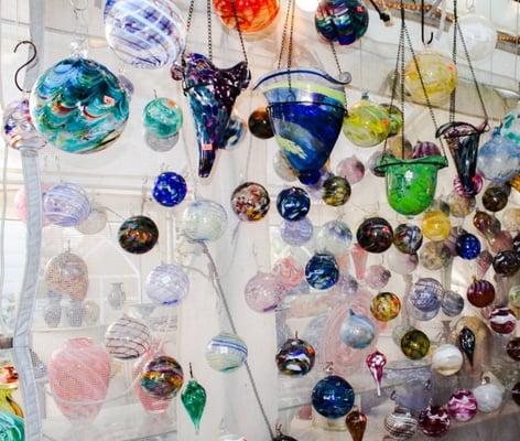 A multitude of beautiful glass ornaments for sale in the studio