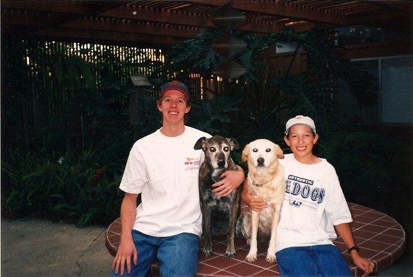 The owner and his brother with our childhood dogs, Katie and Sandy.