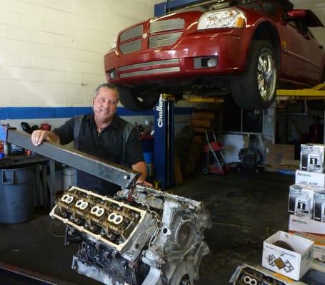 Mike the owner installing the 5.7 Hemi engine in the Dodge Magnum... Yes the owner Mike still love to work on cars and get dirty