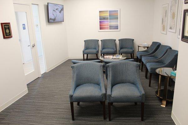 Our comfortable reception area with television, juice, and bottled water.