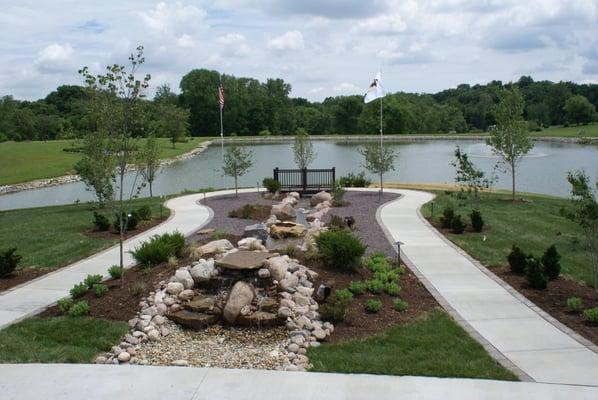 double sided pondless waterfall with stream and landscaping