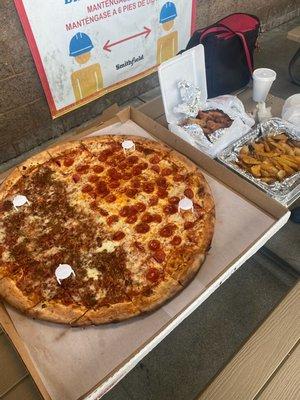 Giant combo pizza with two orders of hot wings and four orders of potatoe wedges for only $80