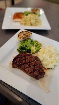 Sirloin steak with red skinned mashed potatoes, broccoli and flame-grilled sourdough bread.