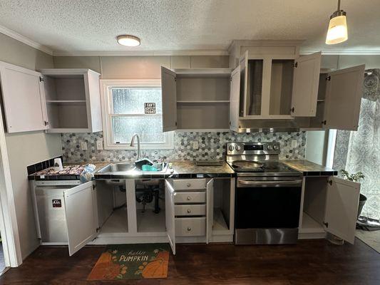 Painted kitchen cabinets and installed backsplash