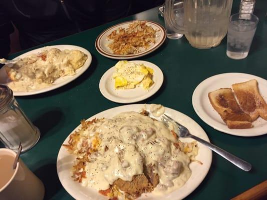 Chicken fried steak platter, cinnamon toast, scrambled eggs, hash browns, and a two biscuit order of biscuits and gravy.