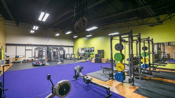 Huge functional training area complete with 5 full racks and platforms, turf and all accessories!