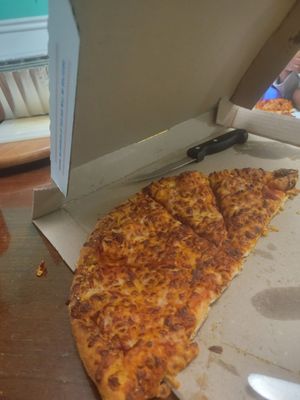 Ordered a pizza for the kids. Came burnt and barely sliced! I've lived near this domino's for a long time, so disappointed!