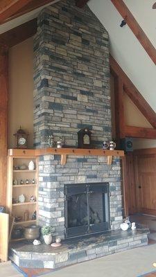 A fireplace built of stone.