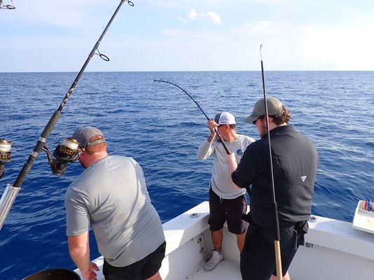 Kishian and Jordan helping reel in the first shark