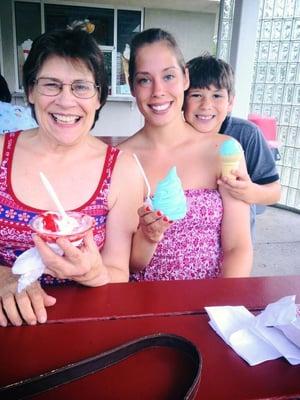 Enjoying  a cherry dip, pistachio flavor, and blue ice cream.