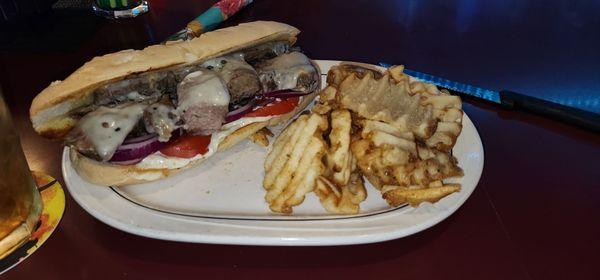 Steak sandwich with waffle fries