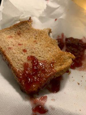 PB and J sandwich served on paper towel