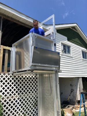 Precision Lifts Outdoor wheelchair lift, being tested after we installed it