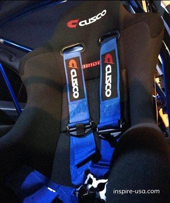 Cusco x Bride collaboration seat with Cusco harness and full roll cage