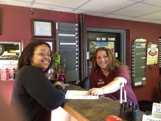 Trish helping a guest at the front counter.