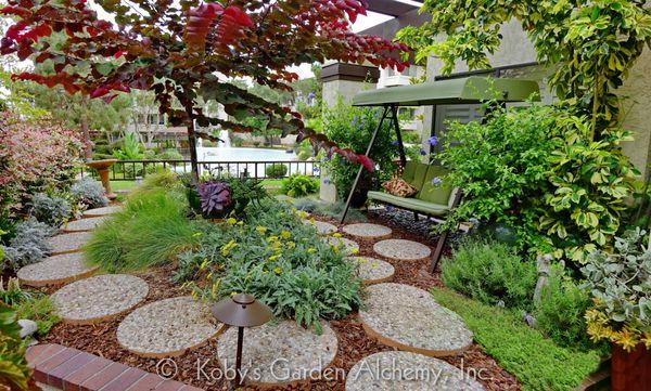 Cozy garden, relaxed seating and open views framed with in colorful foliage.