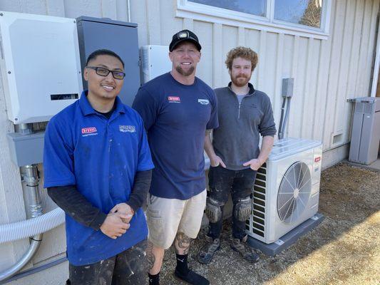 Angel, Charlie and CJ next to our new Bryant Mini Split Heat Pump.   We love our clean heat!