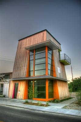 The live/work tower has a gallery below and loft apartment above.