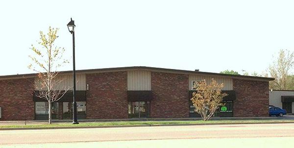 Image of front of building. Minooka Music Studio door is located in interior hallway.