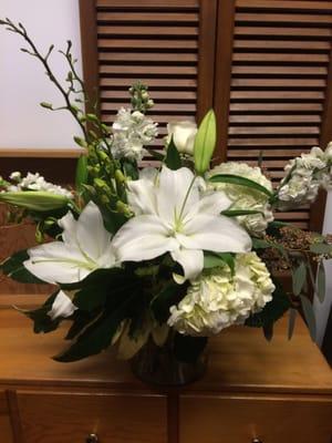 Elegant all white created by our floral artisans.  All of our bouquets are made to order.  Unique as the person receiving them.