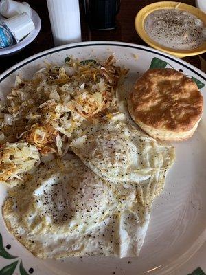 Traditional American breakfast - hash browns and biscuit.