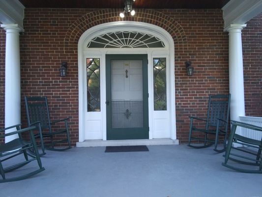 Painted screen door. All trim and rocking chairs