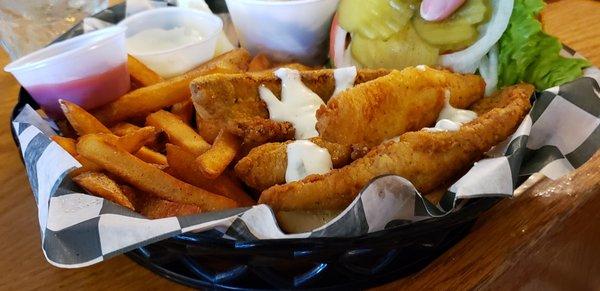 How her's looked after she added the tartar sauce. The top of the sandwich was buried under the fries.