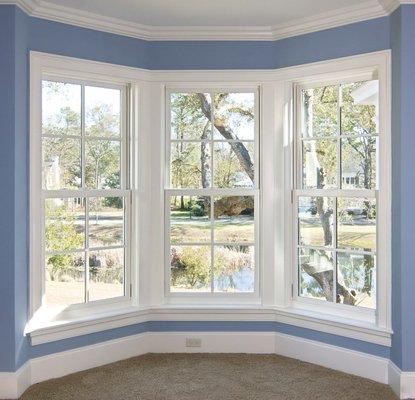 Three Sets of Small Vinyl Windows, Angled to Extend a Room.