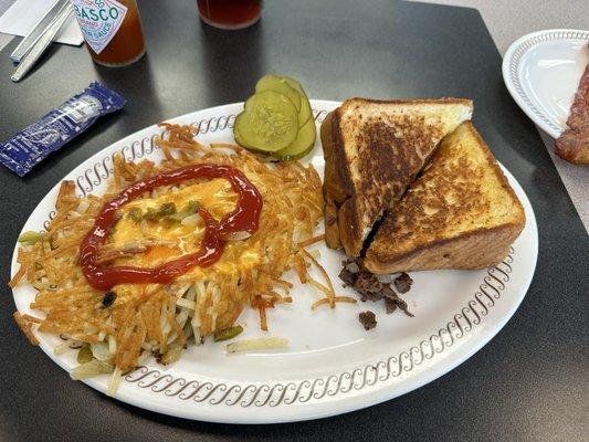 Texas Cheesesteak sandwich & Hashbrowns