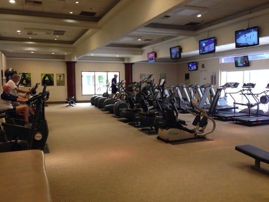 Cardio room with treadmills, stationary bikes and elliptical machines.