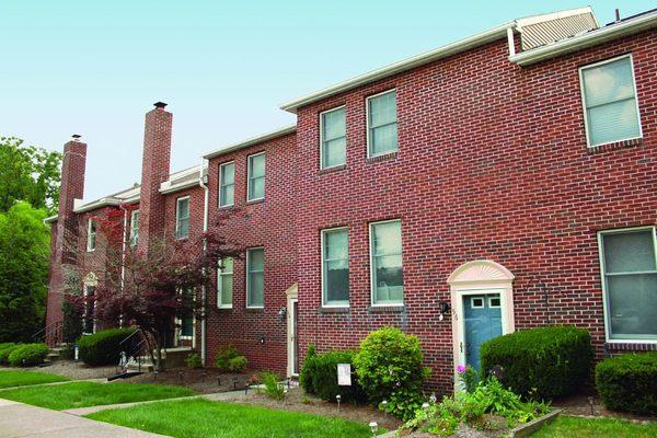 Entryway of our Fairfax Village Townhomes featuring beautiful brick detail.