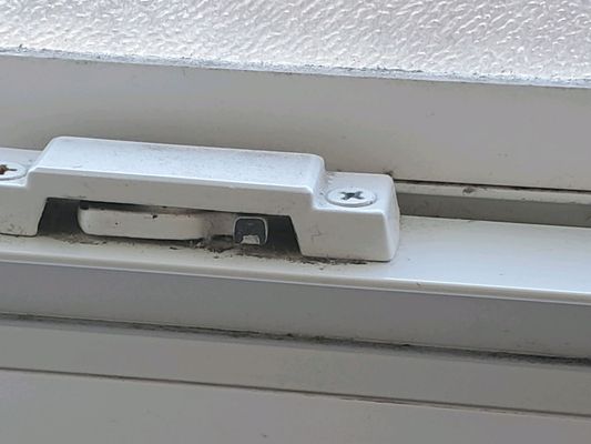 Broken window lock in bathroom.  Considered "cosmetic"