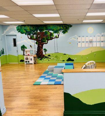 Safe and developmentally appropriate rooms are painted with soothing colors while promoting the art of nature.