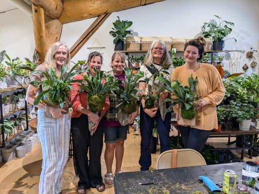 Happy workshop participants with the staghorn ferns they mounted during the class