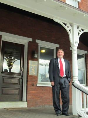 Attorney Eric D. Strand in front of Strand Law Offices in West Chester, PA