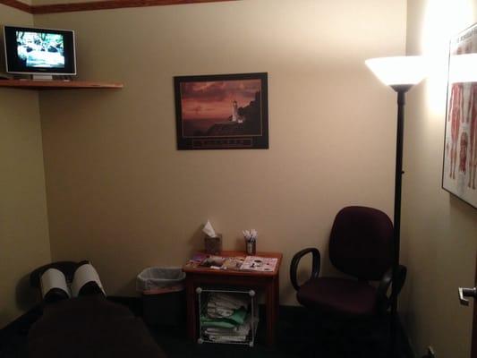 "Relaxation" Treatment Room with ambient lighting and landscape video images.