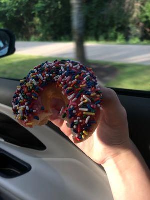 Pink sprinkle donut.