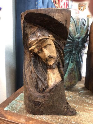 Wooden Jesus face craved into a log