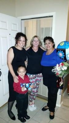 Christmas Eve 2014. Left to right: Care Giver Consultant Sarah and her son Sebastian, Hearts of Gold Administrator Danielle M...