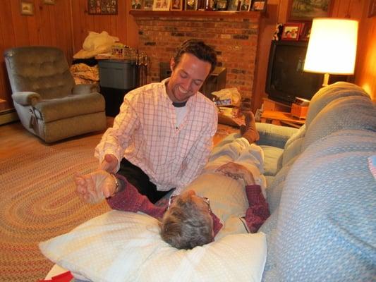 Dr. Warner performing a strengthening technique in the patient's home.