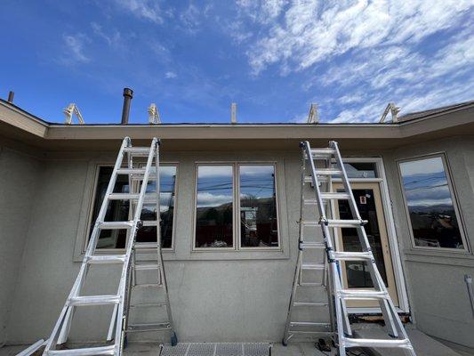 Triangle roof brackets mounted on roof rafters