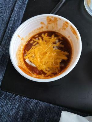 Small Chili topped with onions and cheese.