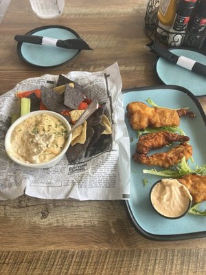 Crab dip with tortilla chips and beer battered mahi bites from the appetizer menu