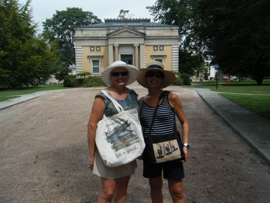 A couple of scruffy tourists loiter in front of the library.