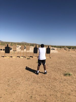 Youth shows interest in learning how to properly handle a firearm.