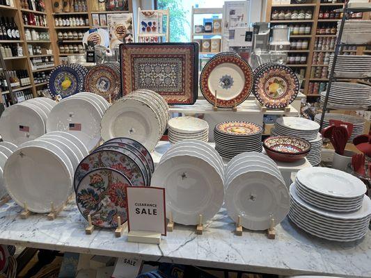 Plates in the foreground and food products in the background