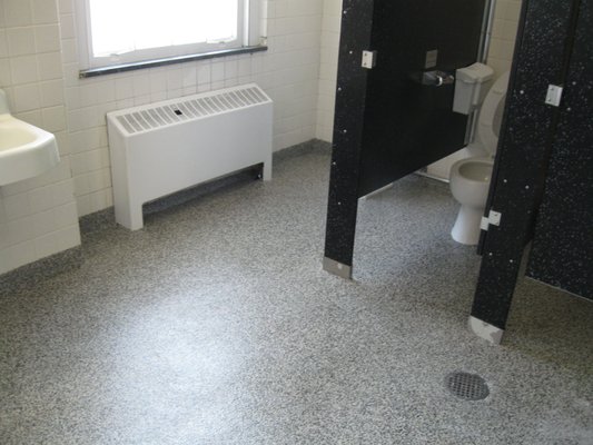 Quarry-Tek installed in college bathroom with floor drain.