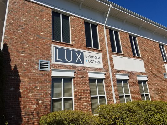 Routed aluminum cut-out sign for LUX Eyecare + Optical