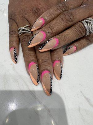 Dip Powder W/tip extensions. Pink, peach, and animal print designs.