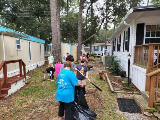 Youth program aiding with community cleanup for those in need after Hurricane Ian 2022.